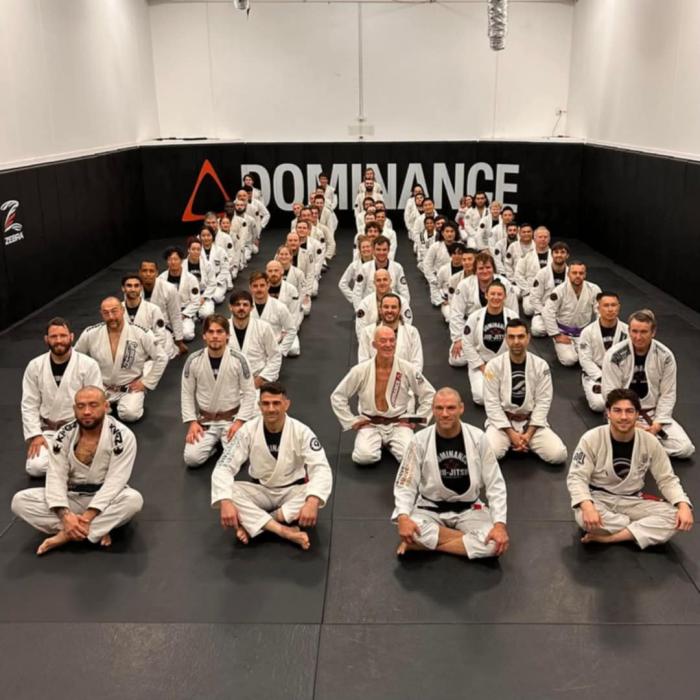 Brown belt grading gym photo third row, third from.front
