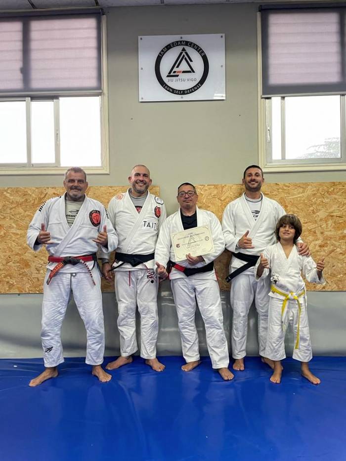 Receiving black belt certificate