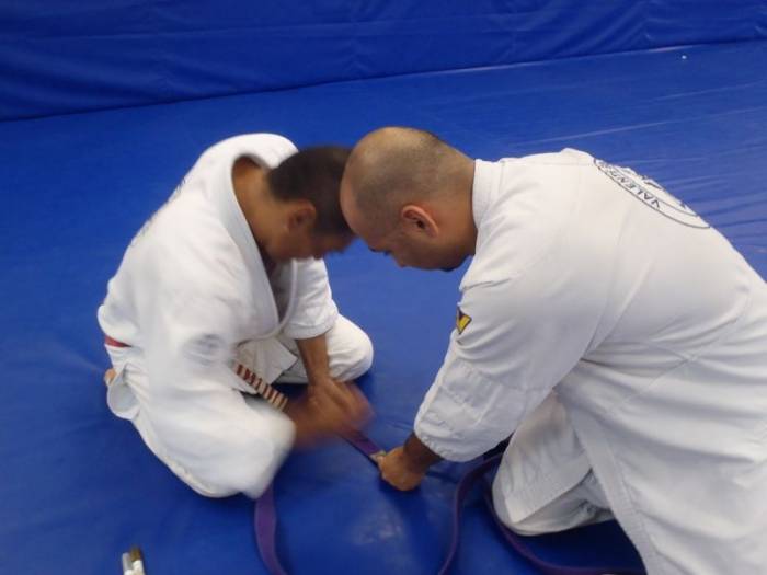 Rickson Gracie signing my purple belt after promotion
