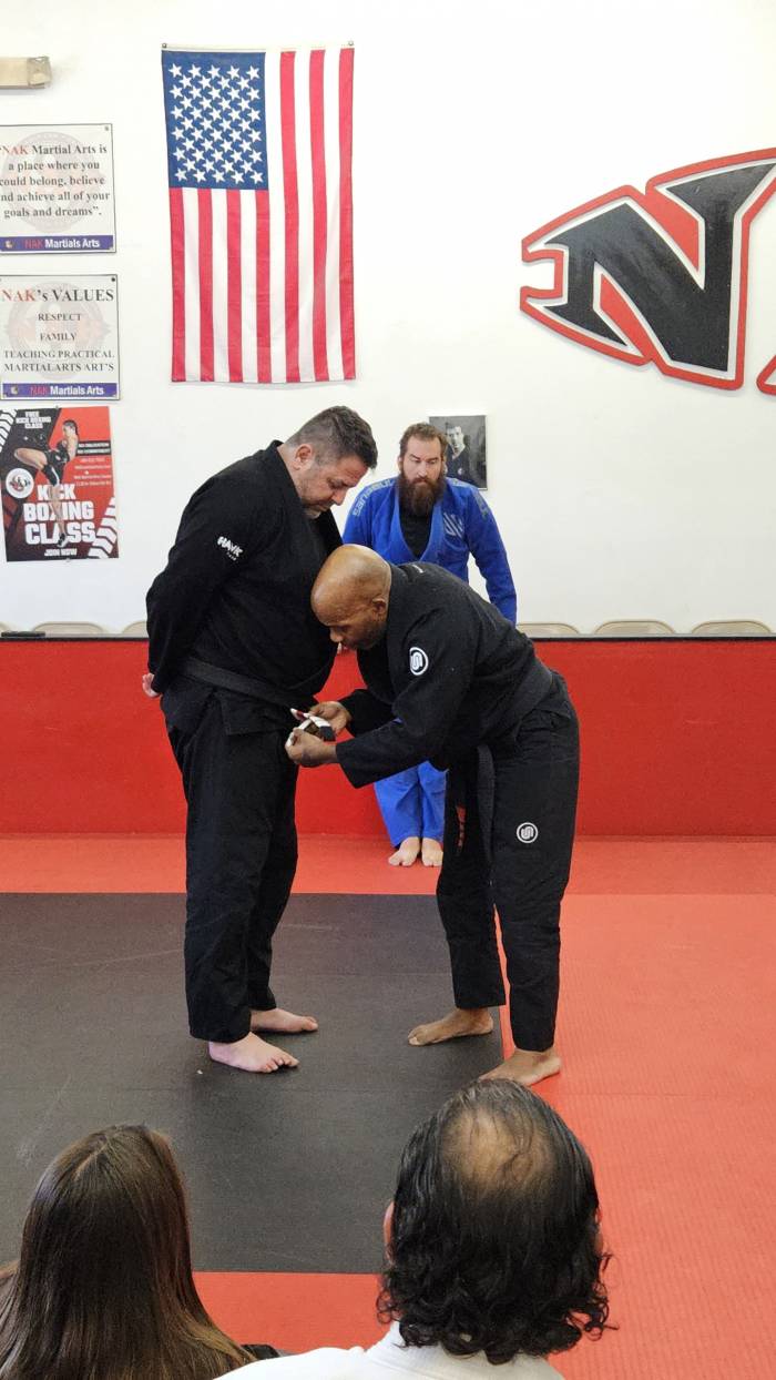 Receiving my second degree stripe on my black belt 8/15/25