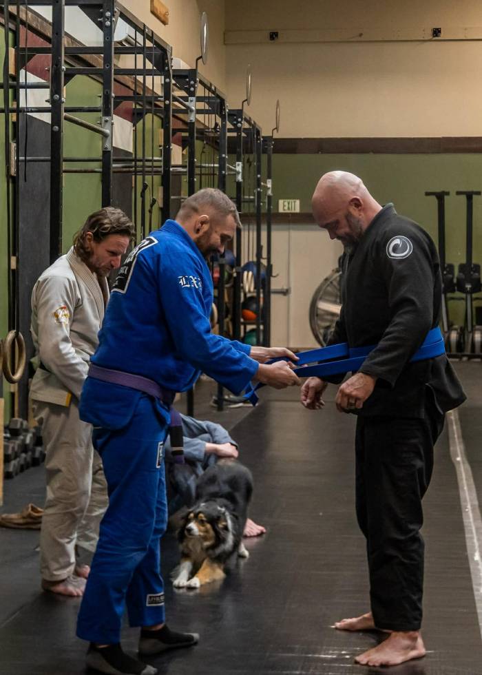 My coach, Ron White. Tying my blue belt