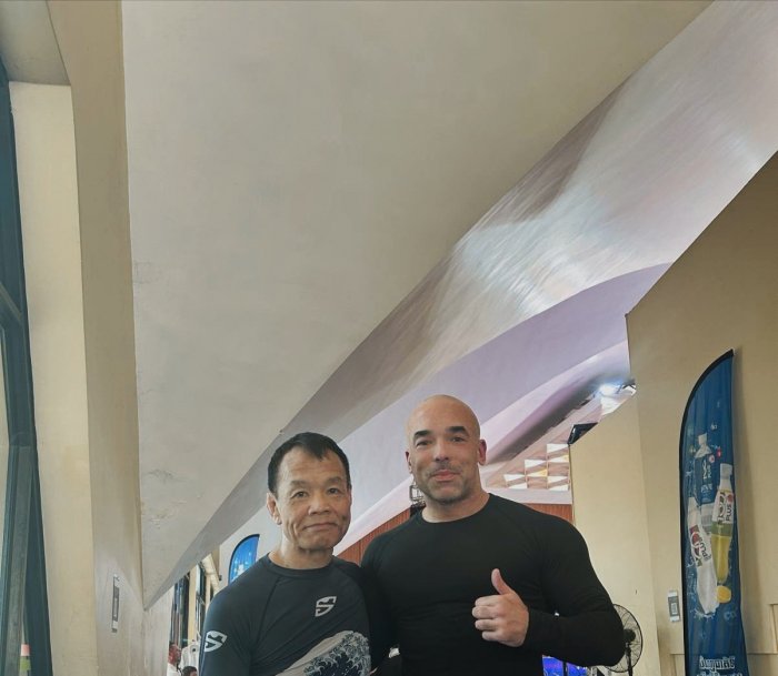 With Japanese black belt Yuji Takakura in Phnom Penh, Cambodia. He helped me warm up for one of my matches.