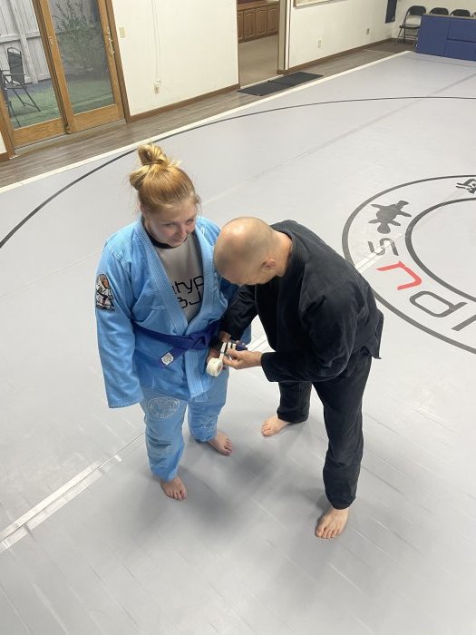 Third stripe on blue belt