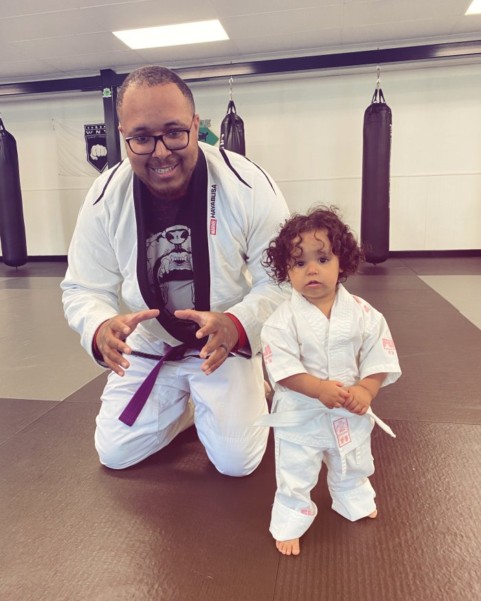 When I was a Purple Belt I started taking my daughter to the gym.  Here we are at one of her first “classes” she likes when Daddy live rolls.
