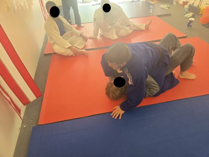 Teaching my students in the early days of Patria Gloria. Even out mats were loaners but we made due with what we had.