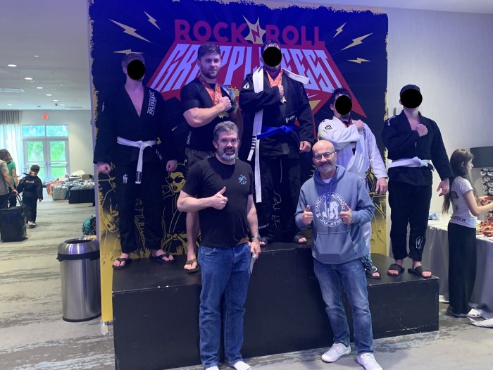 Master Machado and I with my students. It was a special day for me and Tony. After months of terrorizing white belt divisions, he became my first blue belt.