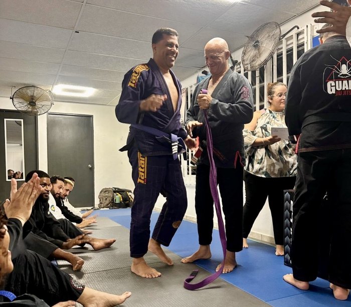 Purple belt · June 4, 2026 · Promoted by Prof. Carlos “Cavernícola” Rodríguez