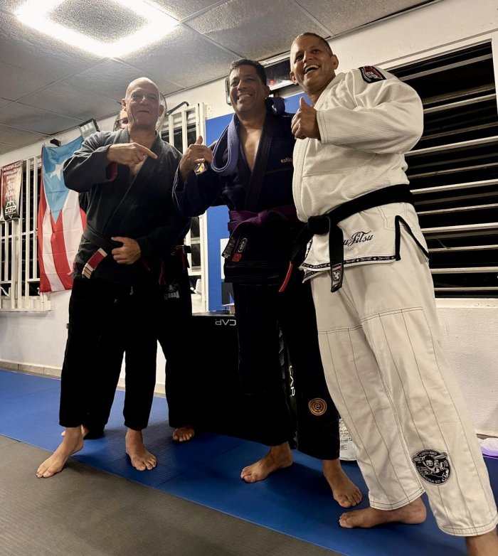 Purple belt · June 4, 2026 · Promoted by Prof. Carlos “Cavernícola” Rodríguez
