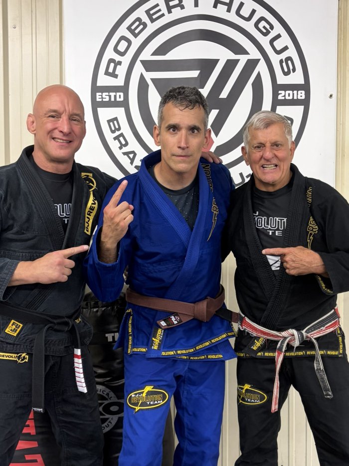 Coral belt Julio “Foca” Fernandez >sixth degree black belt Robert Hugus  @RHBJJ